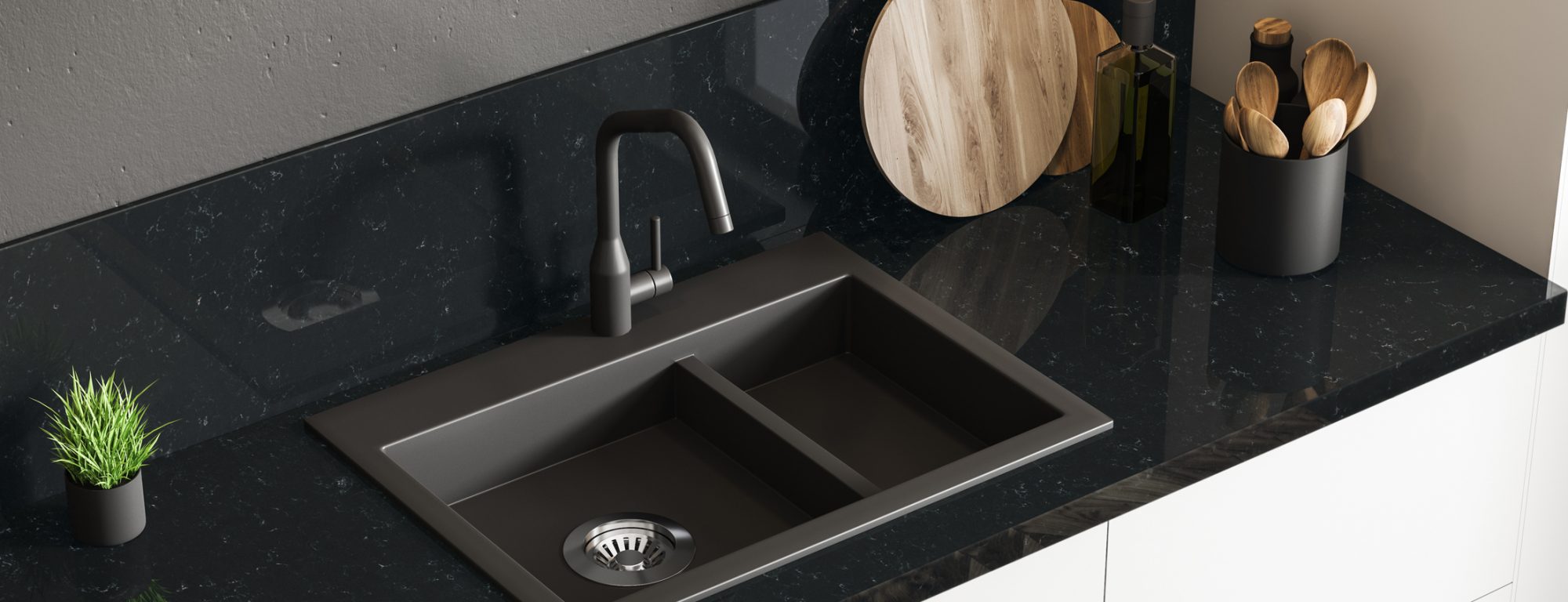 Top view of black marble kitchen sink standing on white countertop in room with black walls. Wooden round cutting board and little potted plant. 3d rendering