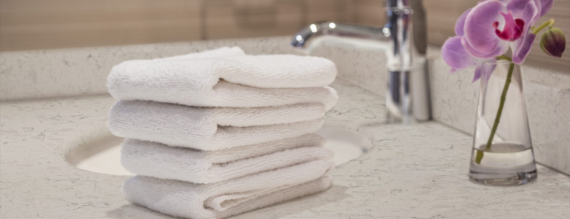 folded white towels in bathroom